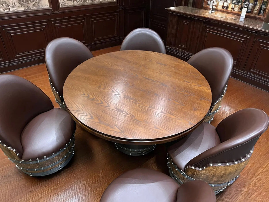 Round wooden table with six matching chairs in a room with wooden paneling.
