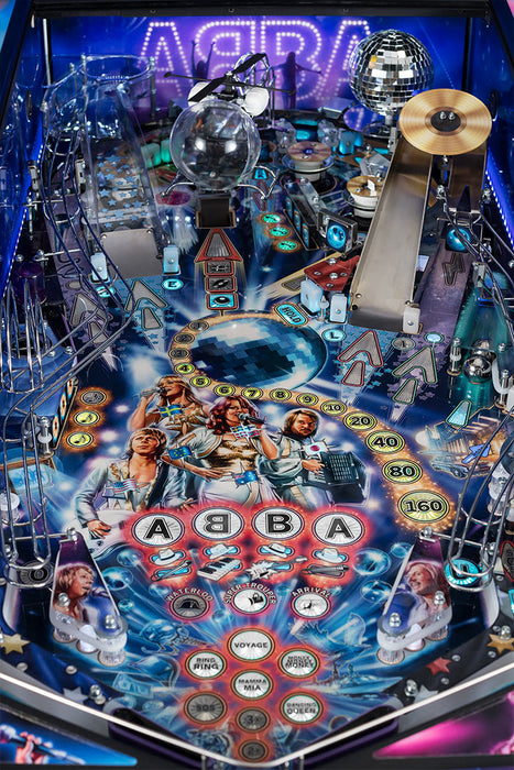 ABBA-themed pinball machine with colorful design and characters.