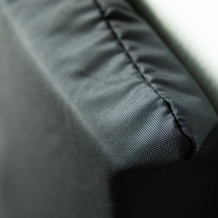 Close-up of a textured black fabric surface
