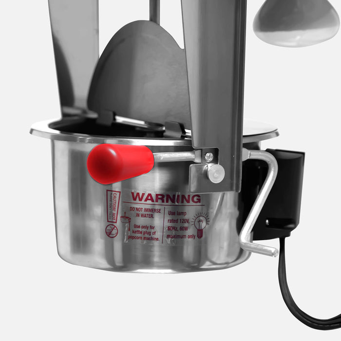 Metal kitchen tool with red warning label on a white background