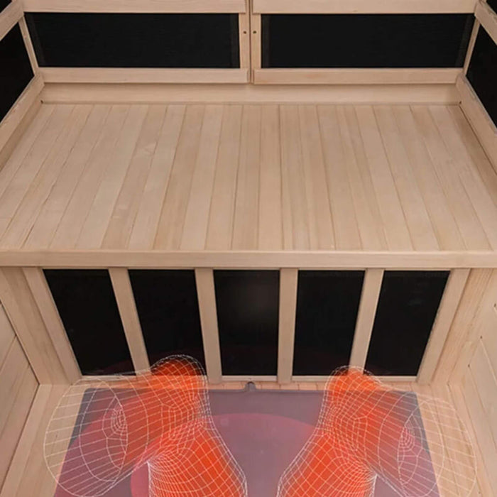 Wooden sauna with black interior panels and a mat on the floor.