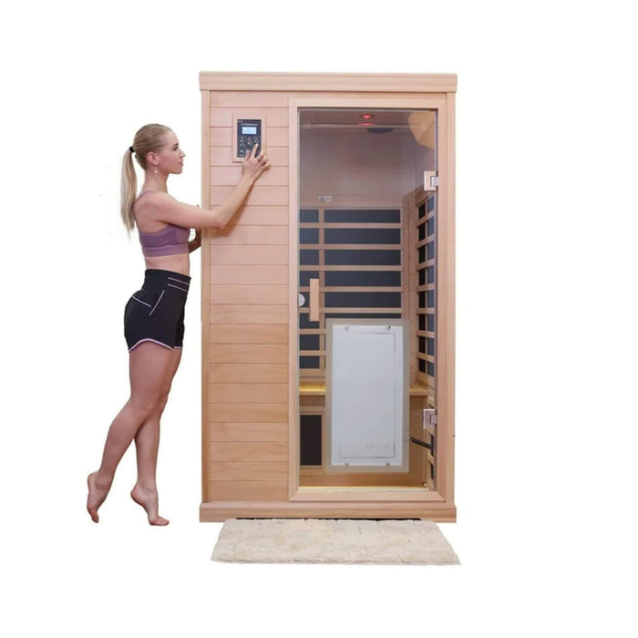 Woman opening a wooden infrared sauna on a white background