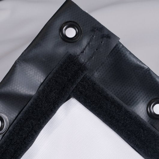 Close-up of a black corner bracket with grommets on a white background