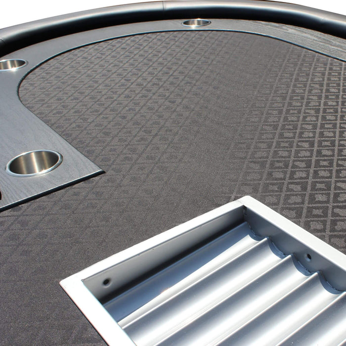 Close-up of a textured gray surface with a metallic border and a rectangular cutout.