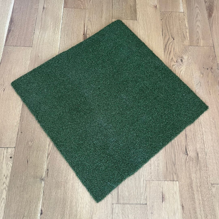 Green scrubber pad on a wooden floor