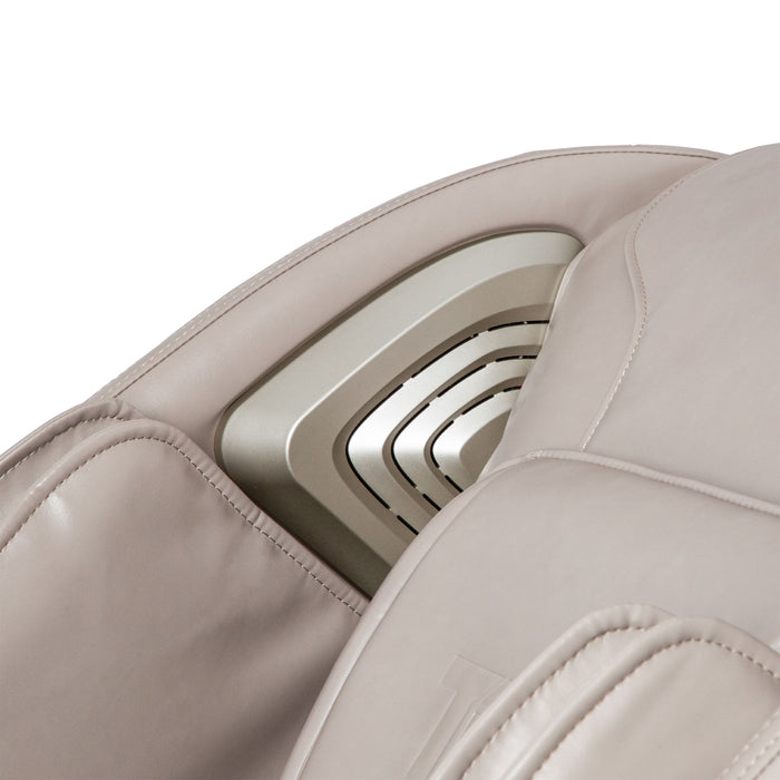 Close-up of beige leather car seat with stitching details on a white background