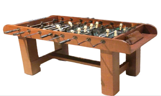 Wooden foosball table on a white background