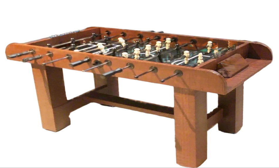 Wooden foosball table on a white background