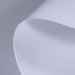 Close-up of textured white fabric with a subtle pattern