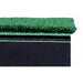 Green artificial grass with black backing on a white background