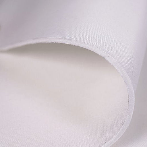 Close-up of a white fabric with a subtle texture on a light gray background