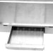Stainless steel drawer with a roll of paper towels inside, on a white background