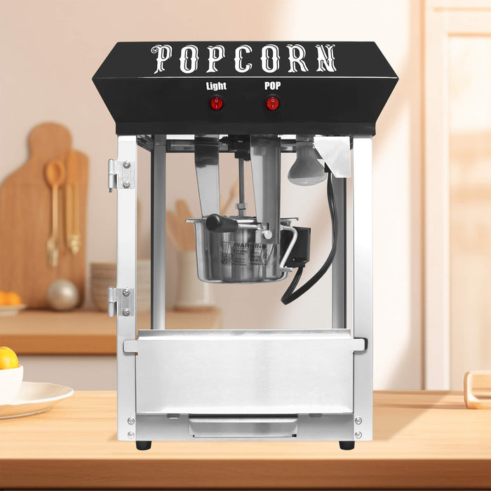 Popcorn machine on a kitchen counter with a blurred background