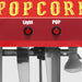 Red popcorn machine with 'Popcorn' text and control buttons on a white background