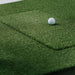 Golf ball on a green practice mat