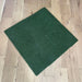 Green scrubber pad on a wooden floor
